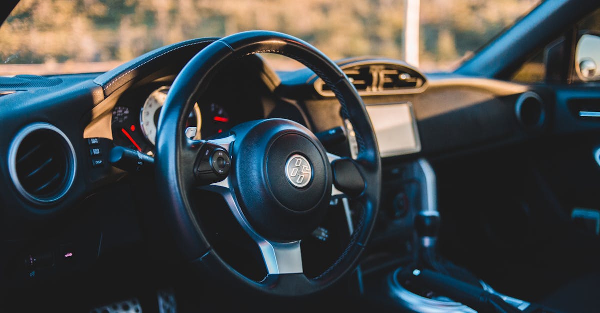 Close-up of a luxury car interior showcasing design, detail, and modern features.