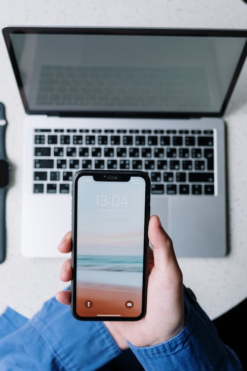 Person Holding Black Iphone 4