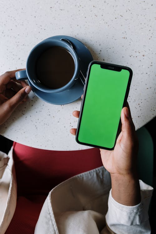 Free Person Holding Green Iphone 5 C Stock Photo