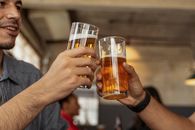Person Holding Clear Drinking Glass