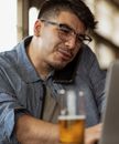Man in Blue Denim Button Up Shirt Wearing Black Framed Eyeglasses