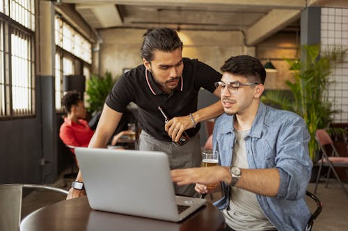 Two Men Looking at a Laptop