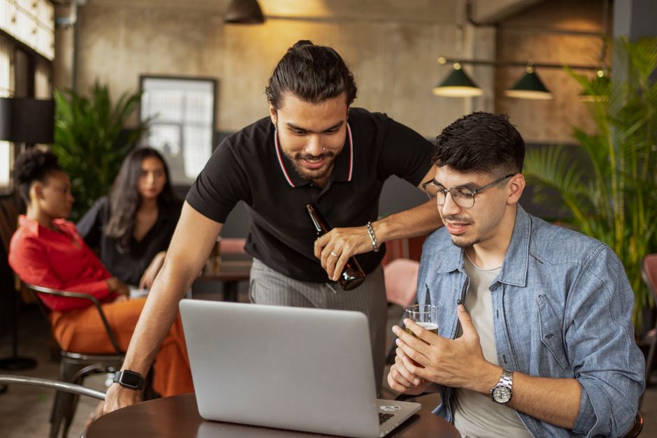 Colleagues collaborating in a modern office with casual atmosphere. Colleagues collaborating in a modern office with casual atmosphere.