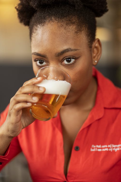 Close-up View of Woman Drinking Beer