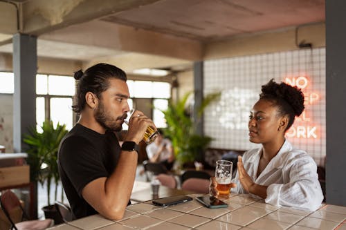 Woman and Man Talking and Drinking