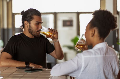 Woman and Man Drinking Beer