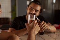 Man in Black Crew Neck T-shirt Holding Clear Drinking Glass