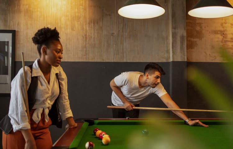 Man And Woman Playing Billiard