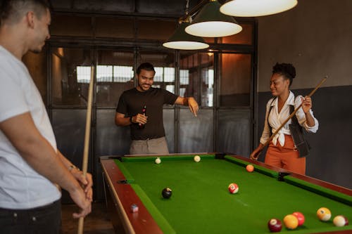 Free People Playing Billiard and Drinking Beer  Stock Photo