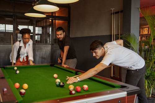 Free Friends Playing Snooker Stock Photo