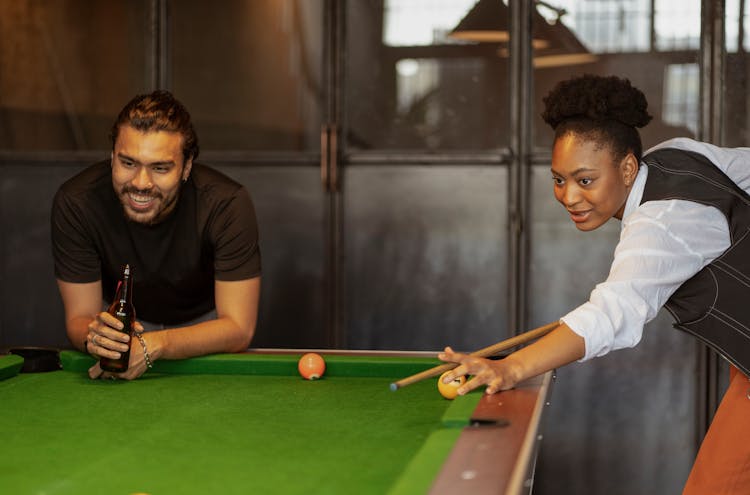 Woman And Man Playing Snooker