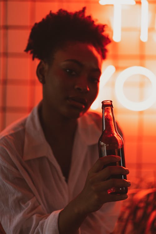 Woman in White Shirt with Beer