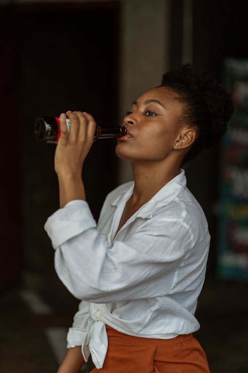 Woman Drinking Bottled Beer 