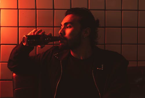 Portrait of Man Drinking From Bottle
