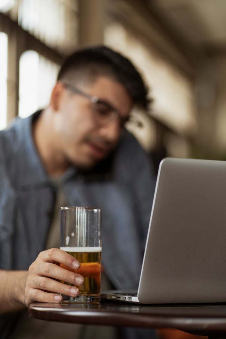 Man With Beer By Laptop