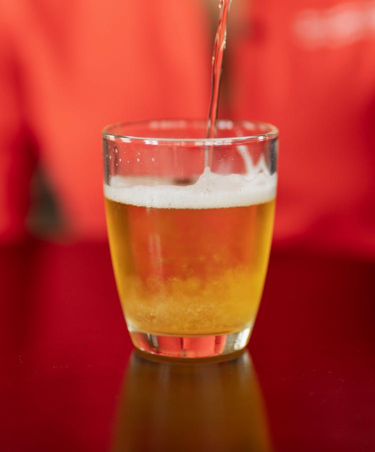 Pouring Beer To Glass