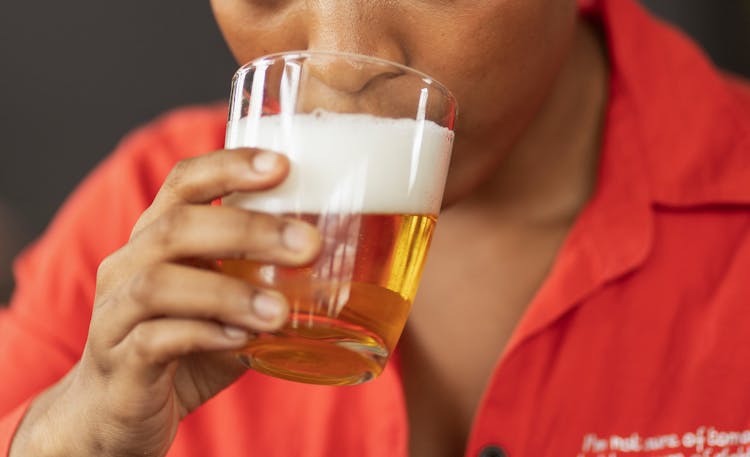 Hand Holding Glass Of Beer