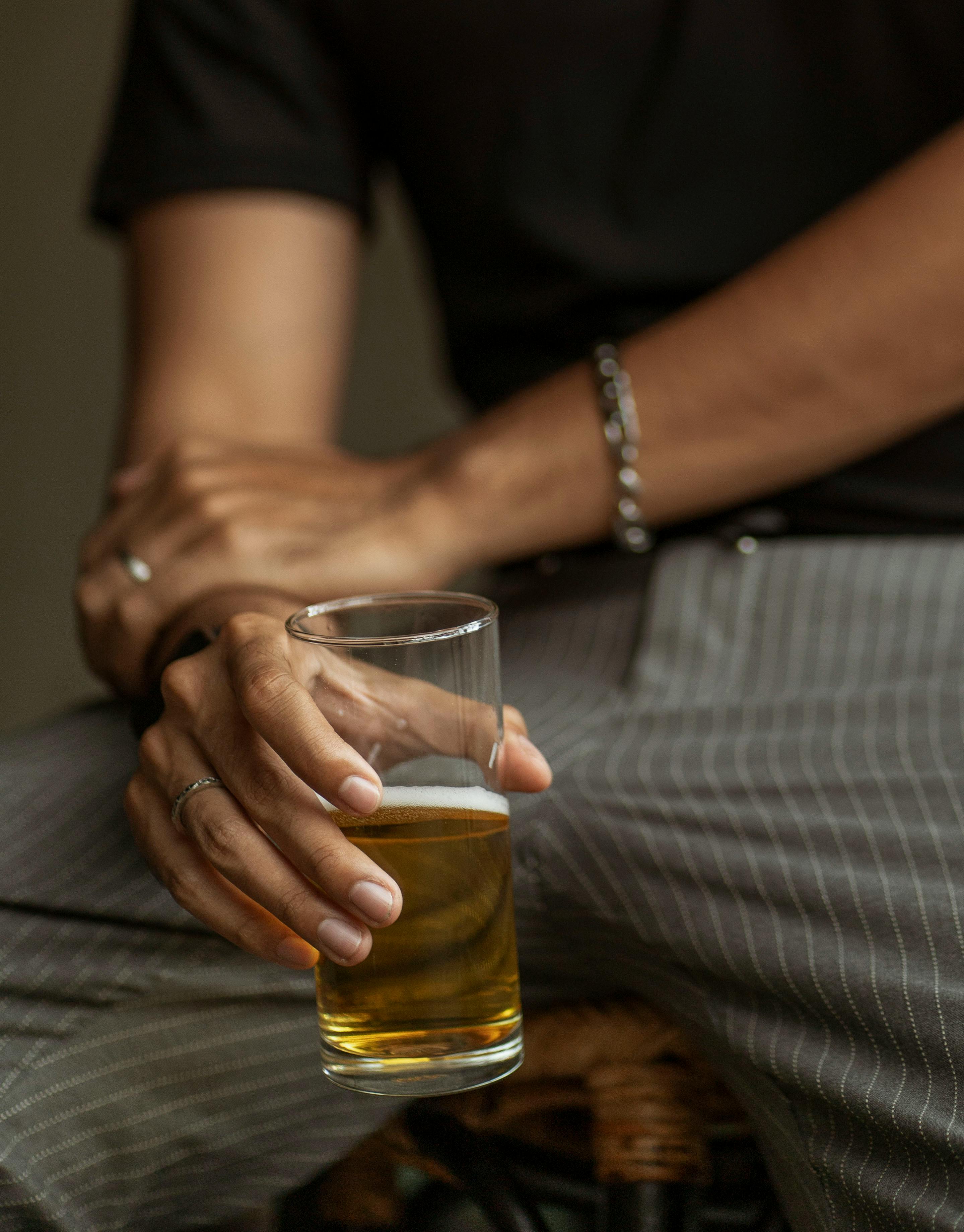 man holding beer in close up