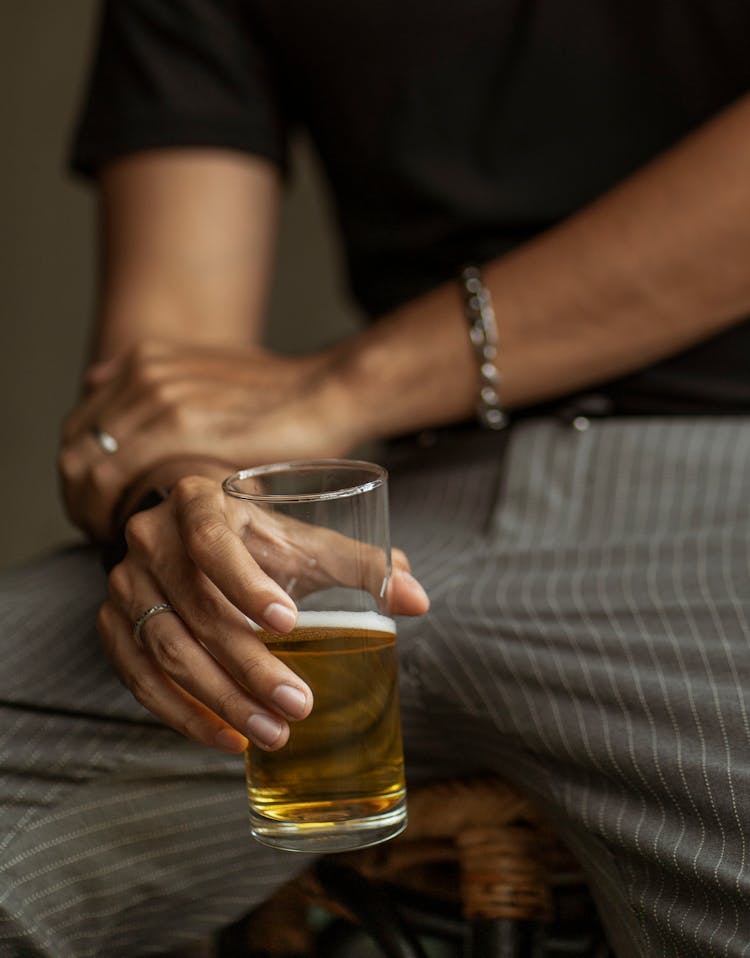 Man Holding Beer In Close Up