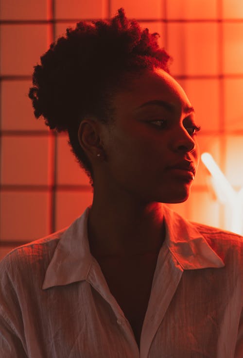 Portrait of a Young Woman in a Red Neon Light 