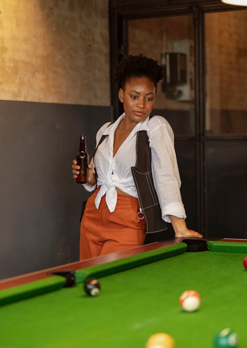 Woman Standing by Pool Table