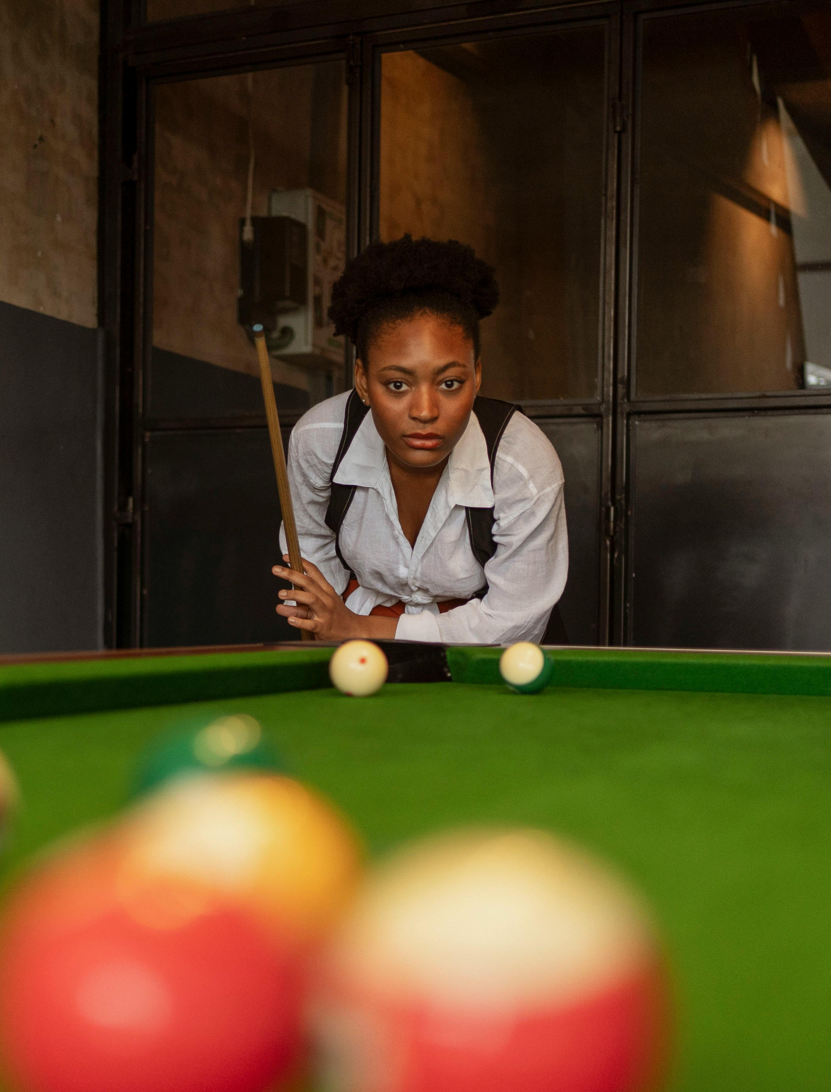 woman playing pool