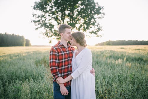 A Couple Standing on the Farm Field