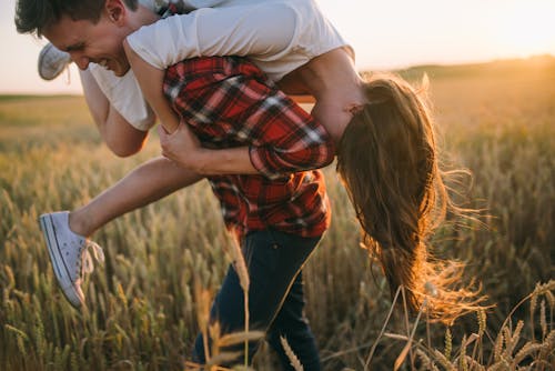 A Couple Having Fun in the Farm Field