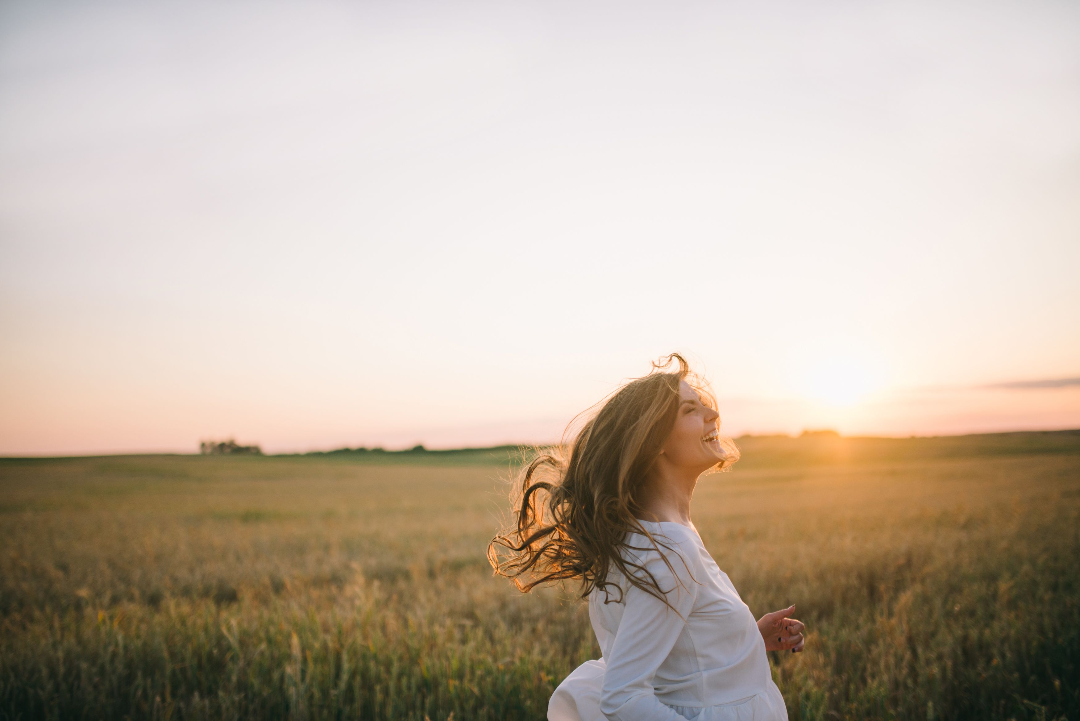 Woman in Wheat Field · Free Stock Photo