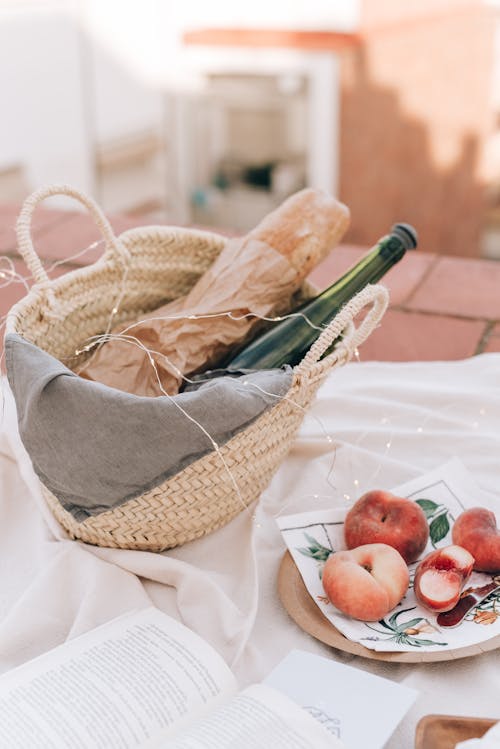 Bread And Bottle Of Wine In A Woven Basket