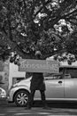 A Man Standing with a Slogan