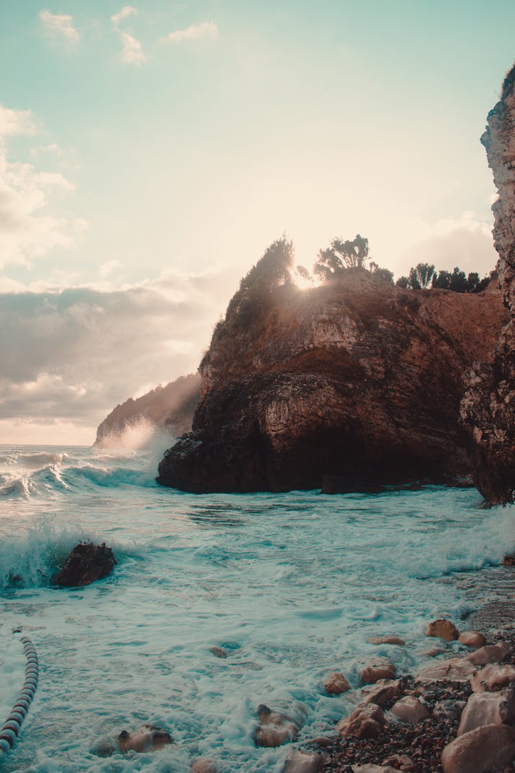 Brown Rock Formation On Sea