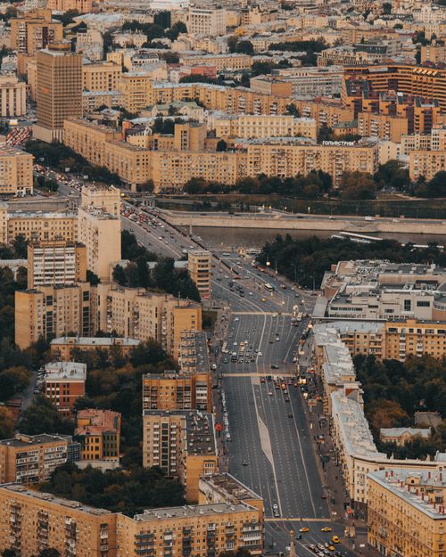 Free Bird's eye view of a bustling city with roads and buildings, showcasing urban architecture. Stock Photo
