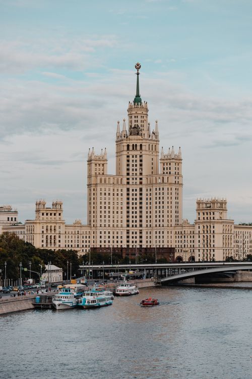 Free A historic Soviet-era building by a river in Moscow, featuring iconic architectural design and urban scenery. Stock Photo