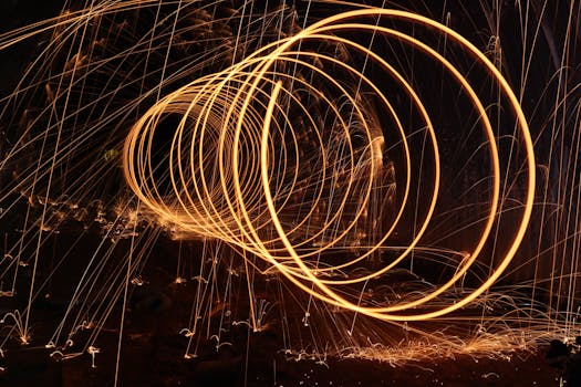 Dazzling long exposure photo capturing vibrant circular light trails at night, creating a mesmerizing visual effect.