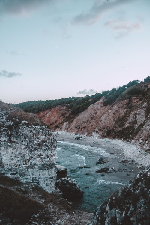 Free Explore serene coastal cliffs and a winding river in Türkiye, captured during twilight, perfect for nature enthusiasts. Stock Photo