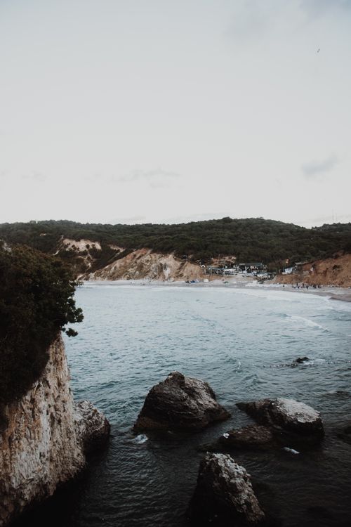 Free Breathtaking coastal view in Türkiye featuring rocky shoreline and serene sea under a clear sky. Stock Photo