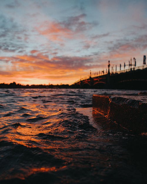 Sunset Reflecting in the River Neva and Silhouetted Trinity Bridge, Saint Petersburg, Russia 