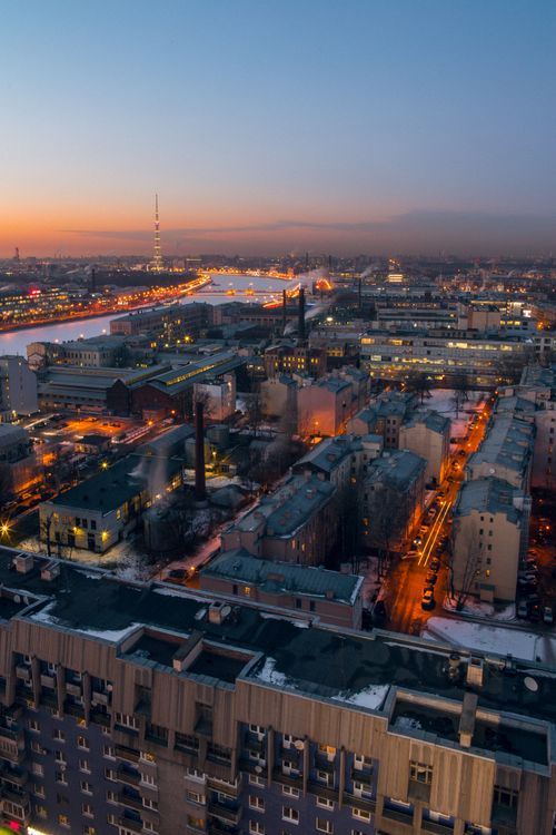 Free Stunning cityscape captured at twilight showcasing illuminated urban architecture and bustling streets. Stock Photo
