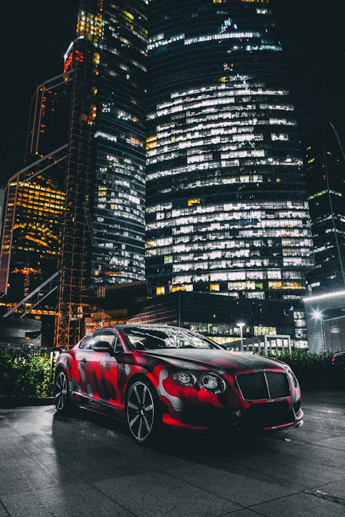 Bentley Continental GT Parked in front of Illuminated Skyscrapers in ...