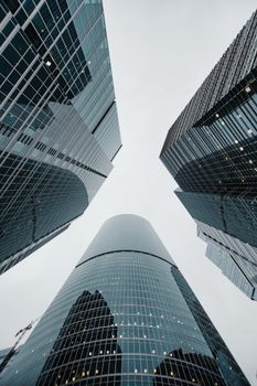 Low-angle view of modern skyscrapers creating a dramatic urban skyline.