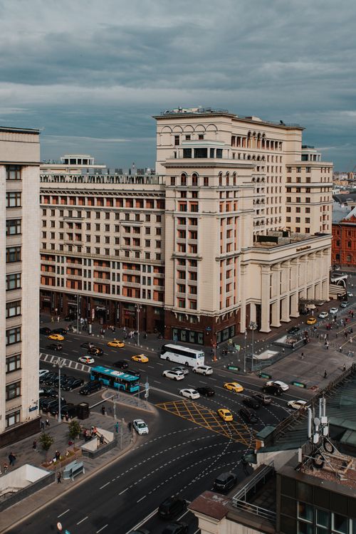 Free Aerial shot of bustling Moscow city streets around a grand building with busy traffic. Stock Photo