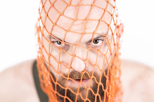 Orange Net on the Man's Face 
