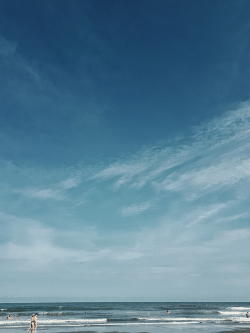 Relaxing beach scene with blue sky in São Paulo, Brazil. Perfect for travel and nature themes.