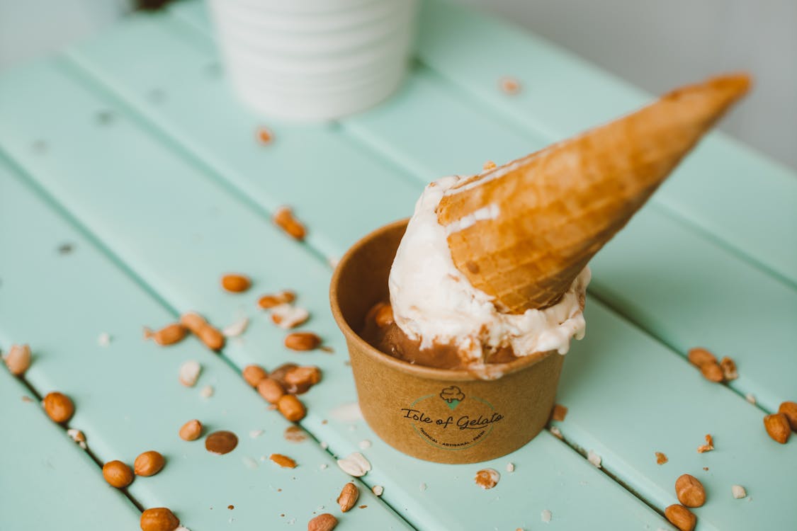 Ice Cream in Paper Cup Decorated with Cone and Peanuts