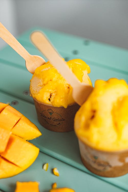 Mango Ice Cream in Paper Cups with Mango Fruits