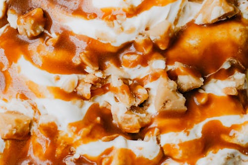 Free Close-up of Ice Cream with Caramel Sauce and Nuts on Top  Stock Photo
