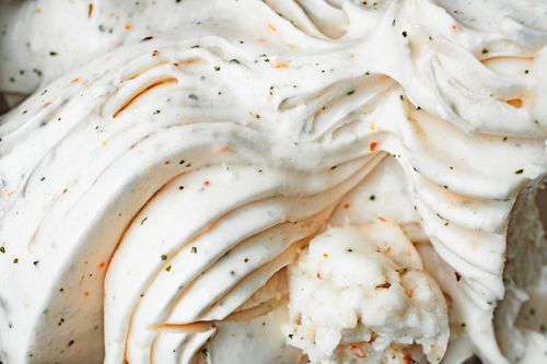 Free Delicious creamy vanilla ice cream with textured swirls and flecks, captured in a close-up view. Stock Photo