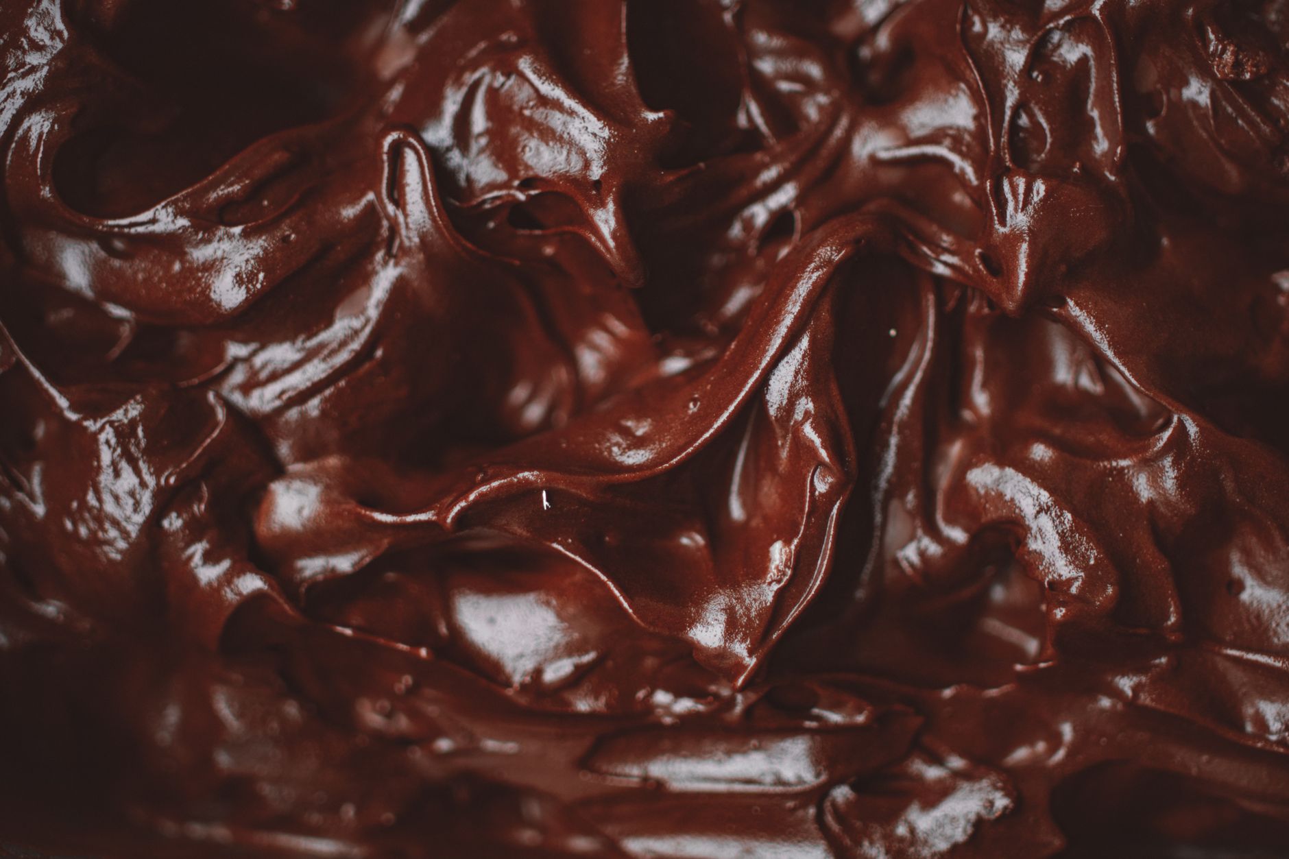 Smooth caramel ganache being whisked
