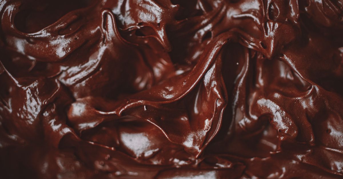 Close-up of a decadent and velvety chocolate ganache, showing its rich texture. - Evidence evidence guide for cocoa flavanol visual performance randomized trial